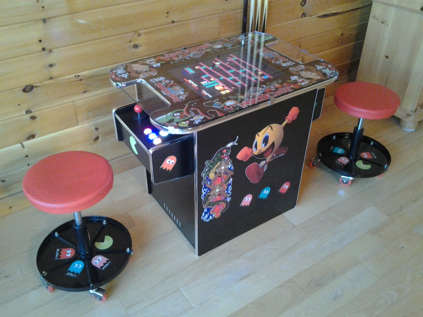 Pac-Man arcade machine — custom cocktail arcade cabinet with matching stools